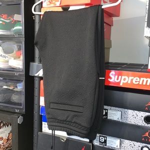 LOUIS VUITTON MONOGRAM TRACK PANTS. WORN LIGHTLY WITH NO RIPS OR TEARS.
